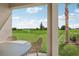 Covered patio with outdoor seating offering a view of the lush green backyard at 1128 Clay Blvd, Tavares, FL 32778