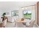 Bright dining area features a modern chandelier and sliding glass doors to the outdoor space at 1128 Clay Blvd, Tavares, FL 32778