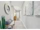 Bright hallway featuring tiled flooring, a bench, decorative art, and recessed lighting at 1128 Clay Blvd, Tavares, FL 32778