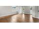 Bedroom features hardwood flooring, natural light, and neutral paint at 120 E Wilt Ave, Eustis, FL 32726