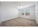 Inviting bedroom featuring neutral carpet and bright windows, creating a serene and comfortable atmosphere at 12027 Language Way, Orlando, FL 32832