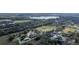 Bird's-eye view features commercial greenhouses and cultivated plots with trees and residential surroundings at 1262 Stonewater Cir, Ocoee, FL 34761