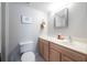 Bright bathroom with wooden vanity, modern toilet, and plenty of counter space for essentials at 1262 Stonewater Cir, Ocoee, FL 34761