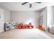 Cozy bedroom with neutral walls, a ceiling fan, and lots of space for activities at 1262 Stonewater Cir, Ocoee, FL 34761