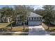 Lovely two-story home featuring a spacious driveway, three-car garage, and picturesque landscaping at 1262 Stonewater Cir, Ocoee, FL 34761