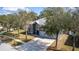 Beautifully maintained home features a spacious driveway, three-car garage, and mature trees at 1262 Stonewater Cir, Ocoee, FL 34761