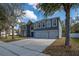 Attractive two-story home with a three-car garage, arched window, and inviting curb appeal at 1262 Stonewater Cir, Ocoee, FL 34761