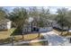 Desirable two-story home offering a spacious driveway, three-car garage, and mature trees at 1262 Stonewater Cir, Ocoee, FL 34761
