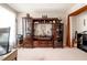 Cozy office space with wooden shelving, decor, and a guitar, creating a peaceful work environment at 1262 Stonewater Cir, Ocoee, FL 34761