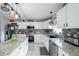 Beautiful kitchen featuring stainless steel appliances, granite countertops and white cabinetry at 1262 Stonewater Cir, Ocoee, FL 34761