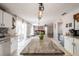 Kitchen with granite countertops and access to the patio and living room at 1262 Stonewater Cir, Ocoee, FL 34761