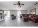 Expansive living area featuring hardwood floors, comfortable seating, and an open layout great for entertaining at 1262 Stonewater Cir, Ocoee, FL 34761