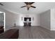 Spacious living room with wood-look flooring and a ceiling fan at 1262 Stonewater Cir, Ocoee, FL 34761