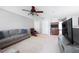 Comfortable living room featuring plush sofas, wet bar, and a modern TV console at 1262 Stonewater Cir, Ocoee, FL 34761