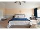 Comfortable main bedroom with a plush bed, ceiling fan, and ample natural light at 1262 Stonewater Cir, Ocoee, FL 34761