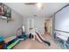 Bright playroom with a variety of toys, a slide, and ample space for children to play at 1262 Stonewater Cir, Ocoee, FL 34761