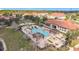 Aerial view featuring a community pool with ample seating, perfect for relaxation at 178 Marcello Blvd, Kissimmee, FL 34746