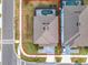 Overhead shot of a gray roofed home featuring a private backyard, outlined property, and street access at 178 Marcello Blvd, Kissimmee, FL 34746