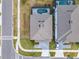 Aerial view of the roof, driveway, and pool with screened enclosure of a home and its neighbor at 178 Marcello Blvd, Kissimmee, FL 34746