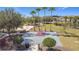 Community featuring an outdoor basketball court surrounded by lush landscaping at 178 Marcello Blvd, Kissimmee, FL 34746