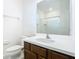 Bathroom with a modern vanity, a large mirror, and a shower with tile surround at 178 Marcello Blvd, Kissimmee, FL 34746