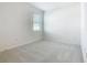 Neutral bedroom with plush carpet, offering tranquility and ample natural light at 178 Marcello Blvd, Kissimmee, FL 34746