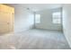 Bright bedroom with plush carpeting and natural light, ideal for rest and relaxation at 178 Marcello Blvd, Kissimmee, FL 34746