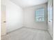 Neutral bedroom with carpet, a window, and closet doors at 178 Marcello Blvd, Kissimmee, FL 34746
