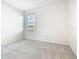 Bright bedroom with neutral walls and plush carpeting, promoting a serene ambiance at 178 Marcello Blvd, Kissimmee, FL 34746
