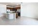 Bright modern kitchen features stainless steel appliances, custom cabinetry, a kitchen island and tiled floors at 178 Marcello Blvd, Kissimmee, FL 34746