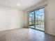 Bright living room with sliding glass doors leading to a screened outdoor patio at 178 Marcello Blvd, Kissimmee, FL 34746