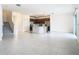Open-concept area that connects the living room, kitchen, and stairs to upper floors at 178 Marcello Blvd, Kissimmee, FL 34746