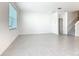 Spacious living room with natural light and a view of the staircase to the upper floors at 178 Marcello Blvd, Kissimmee, FL 34746