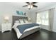 Serene bedroom with hardwood floors, a tufted headboard, and bright natural light at 2006 Deborah Dr, Orlando, FL 32817