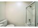 Bathroom featuring a toilet and tub with glass shower door at 2125 Kilmer Ln, Apopka, FL 32703