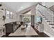 Bright living room with high ceilings, hardwood floors, a staircase, and sliding glass doors to the patio at 2228 Hoffner Ave, Belle Isle, FL 32809