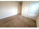 The carpeted bedroom features neutral paint, electrical outlets, and neutral trim at 2877 Sunridge Loop, St Cloud, FL 34771