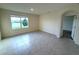 Bedroom featuring a large window with a view of the lake, neutral walls, and tile floors at 2877 Sunridge Loop, St Cloud, FL 34771