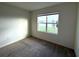 Bedroom with carpet flooring, natural light, and a view of the lake at 2877 Sunridge Loop, St Cloud, FL 34771