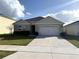 Charming single-Gathering home featuring a well-manicured lawn and attached two-car garage at 2877 Sunridge Loop, St Cloud, FL 34771