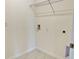 A compact laundry area includes tile flooring and washer/dryer hookups at 2877 Sunridge Loop, St Cloud, FL 34771