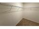 Walk-in closet with carpet and wire shelving for ample storage at 2877 Sunridge Loop, St Cloud, FL 34771