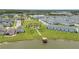 Stunning aerial view of the community featuring a lake, well-manicured green spaces, and picturesque homes at 2916 Satire St, Kissimmee, FL 34746