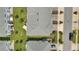 Aerial view of townhome rooftops, green lawns, manicured landscaping, and paver driveways at 2916 Satire St, Kissimmee, FL 34746