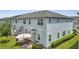Backyard view showcasing the patio and grass area with a wooden table and chairs at 2916 Satire St, Kissimmee, FL 34746