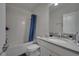 Bathroom featuring tiled shower-tub combo and stone countertop vanity at 2916 Satire St, Kissimmee, FL 34746