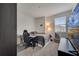 Bedroom featuring neutral carpet, large windows and study area at 2916 Satire St, Kissimmee, FL 34746
