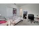 Bedroom featuring neutral carpet, white trim and closet at 2916 Satire St, Kissimmee, FL 34746