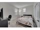 Bedroom showcasing neutral carpet and bright natural light from large windows at 2916 Satire St, Kissimmee, FL 34746