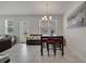 Bright dining area with a table, chairs, bench, and lots of natural light at 2916 Satire St, Kissimmee, FL 34746
